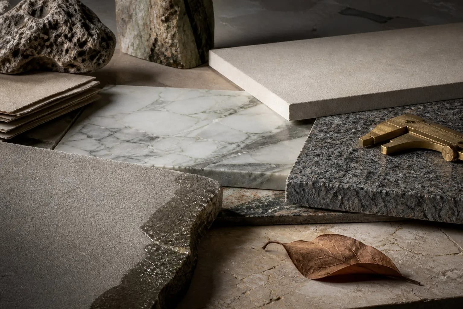 Curated natural stone samples showing varied finishes, veining and ageing
