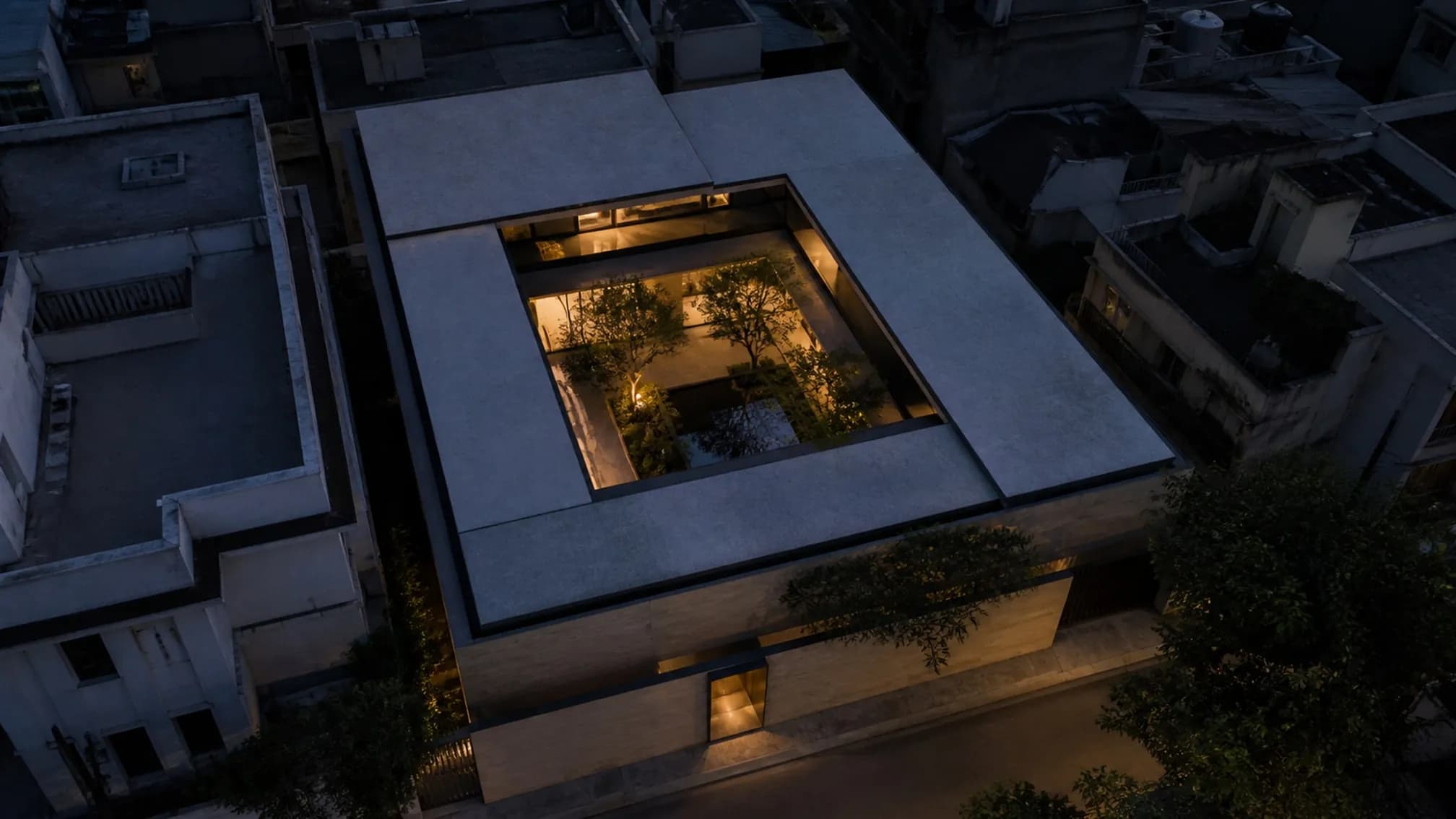 Aerial view showing the square footprint wrapped tightly around a central courtyard, dense rooftops on all four sides