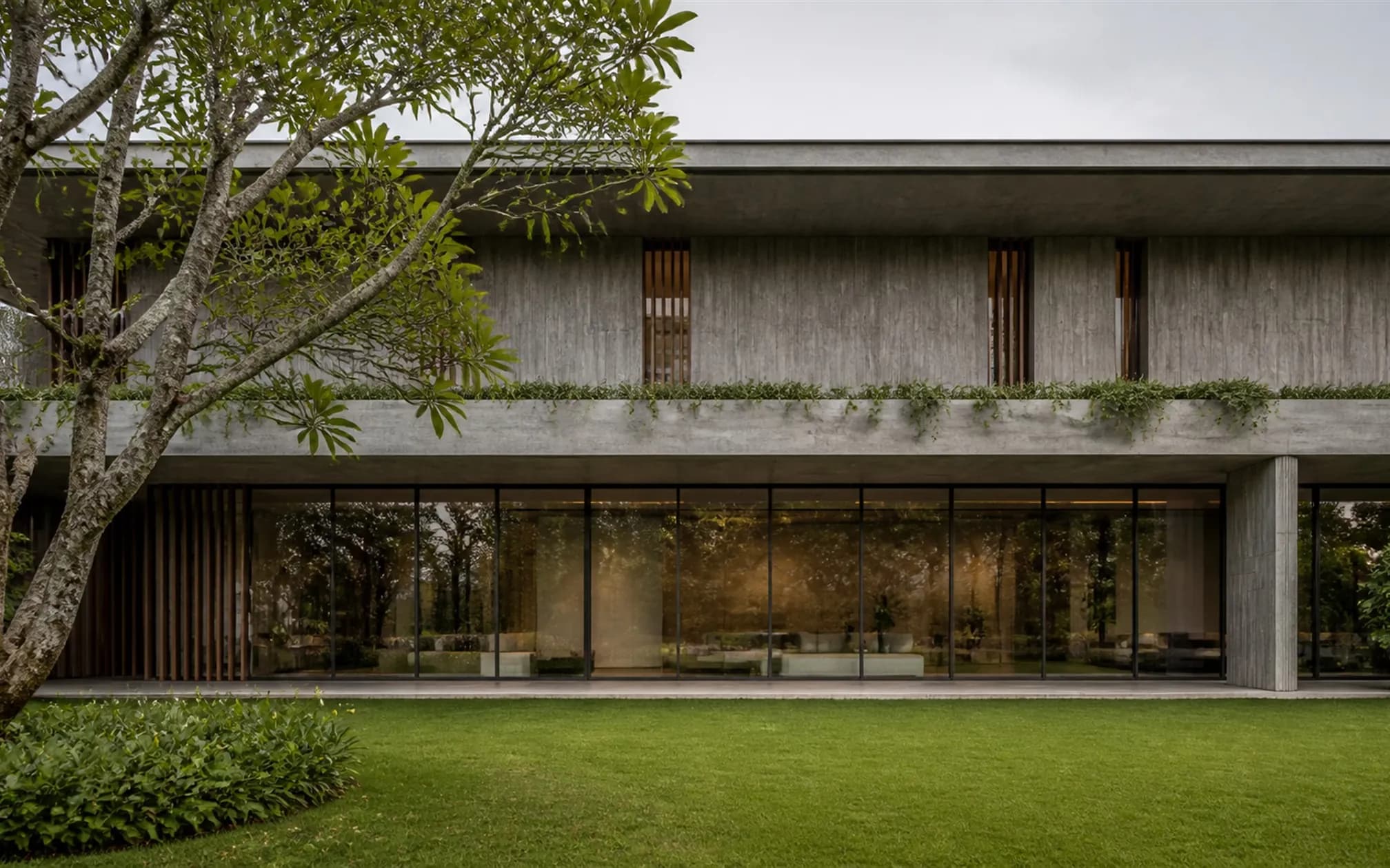 North elevation, a calm horizontal composition of travertine and a continuous ribbon of bronze-framed glazing