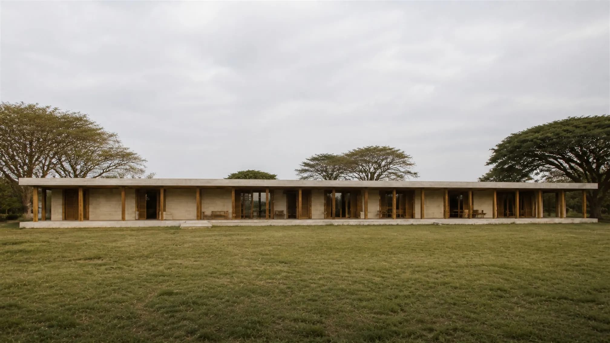 Front elevation — an extremely horizontal composition of evenly spaced teak columns beneath a deep flat concrete roof